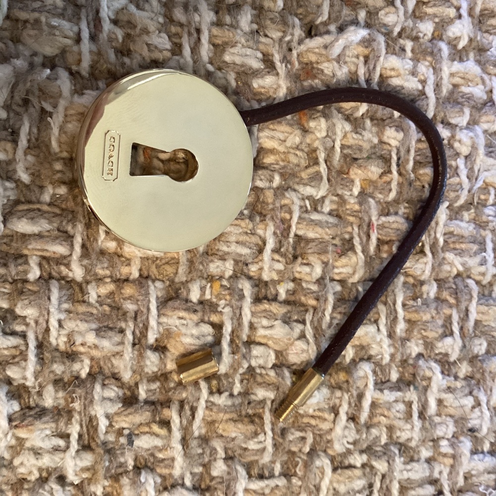 Coach gold tone round key ring with brown closer for adding keys securely. - Picture 4 of 5